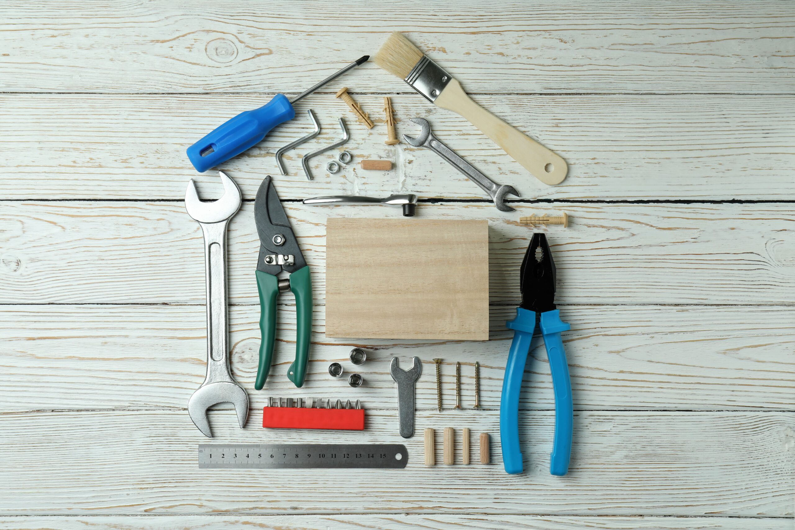 house-made-of-working-tools-on-white-wooden-backgr-2026-03-24-21-49-39-utc (1)